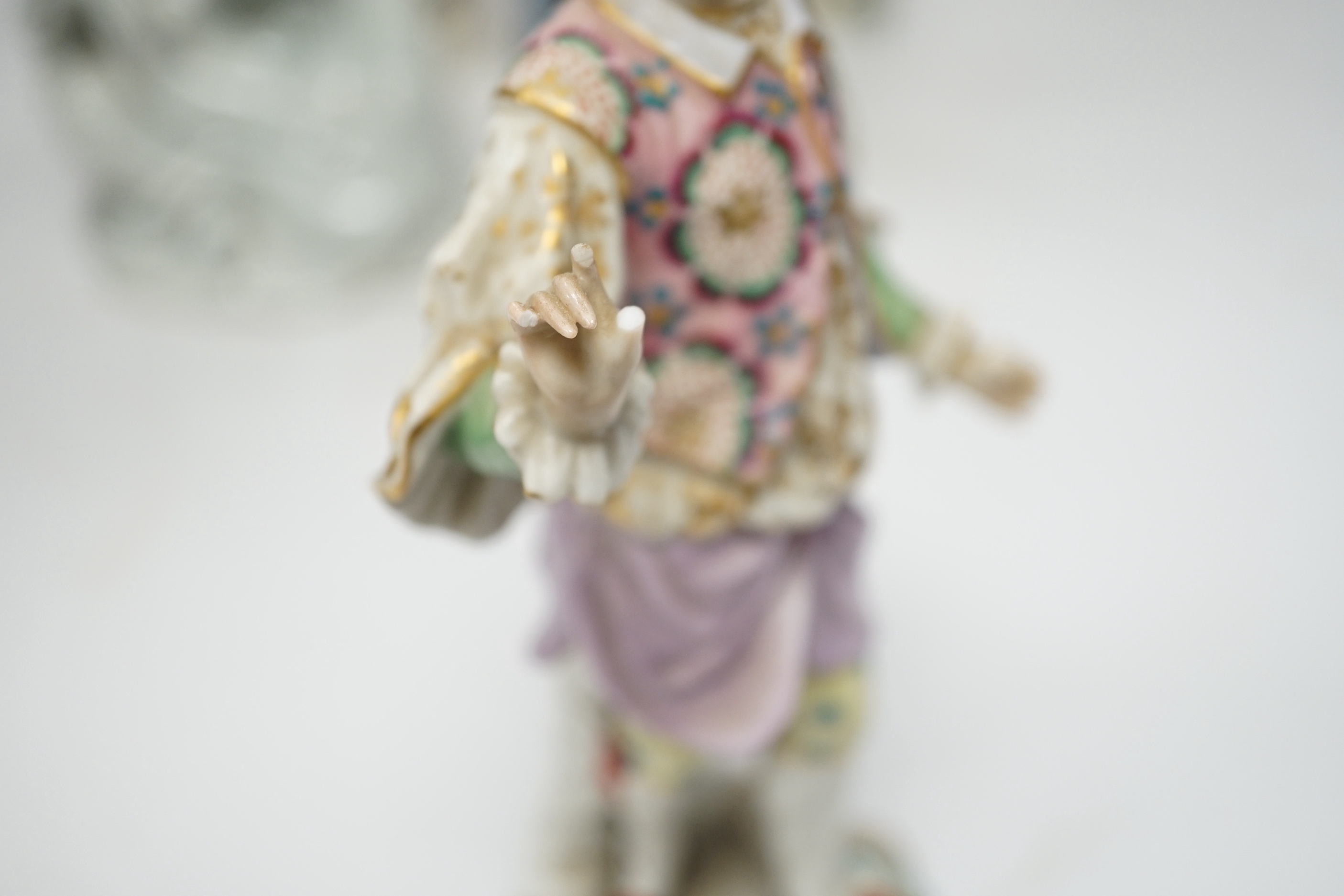 Eight porcelain figures including a pair of German style figures, a large Figo group, feeding a lamb, two Chinese figures, a bust of Beethoven, etc. largest 37cm